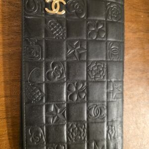 CHANEL Black Embossed Wallet with Gold Logo